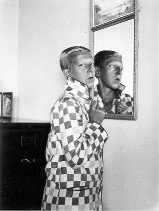 Self-Portrait (reflected image in mirror, checqued jacket) (1928)