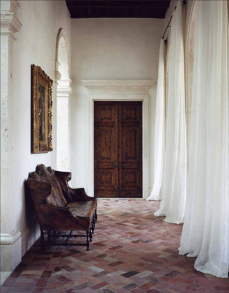 A 17th century Italian settee and curtains in the south gallery leading to the master suite- photo by François Halard