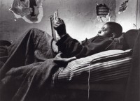 Norman Jr. Reading in Bed, 1967. Photo by Gordon Parks