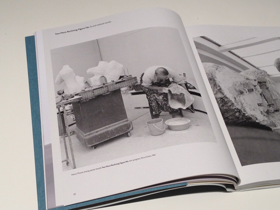 Henry Moore mixing plaster beside Two Piece Reclining Figure No. 4 in progress, Perry Green, 1961. Photo copyright John Hedgecoe
