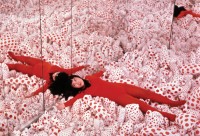 Kusama in Infinity Mirror Room – Phalli’s Field (1965) at “Floor Show,” Castellane Gallery, New York.  Copyright Yayoi Kusama Studio, Inc.; Courtesy Ota Fine Arts, Tokyo; Victoria Miro Gallery, London; Gagosian Gallery, New York