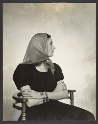[Woman in Scarf Seated in Chair] (1930s-40s)