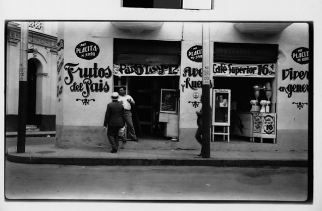 [Street Scene in Front of Cafe -Frutos del Pais-, Havana] (1933)